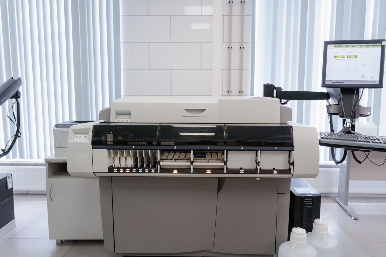 Mastering the First Impression: Your intriguing post title goes here A high-tech office setup featuring a printer and computer workstation ready for productivity.